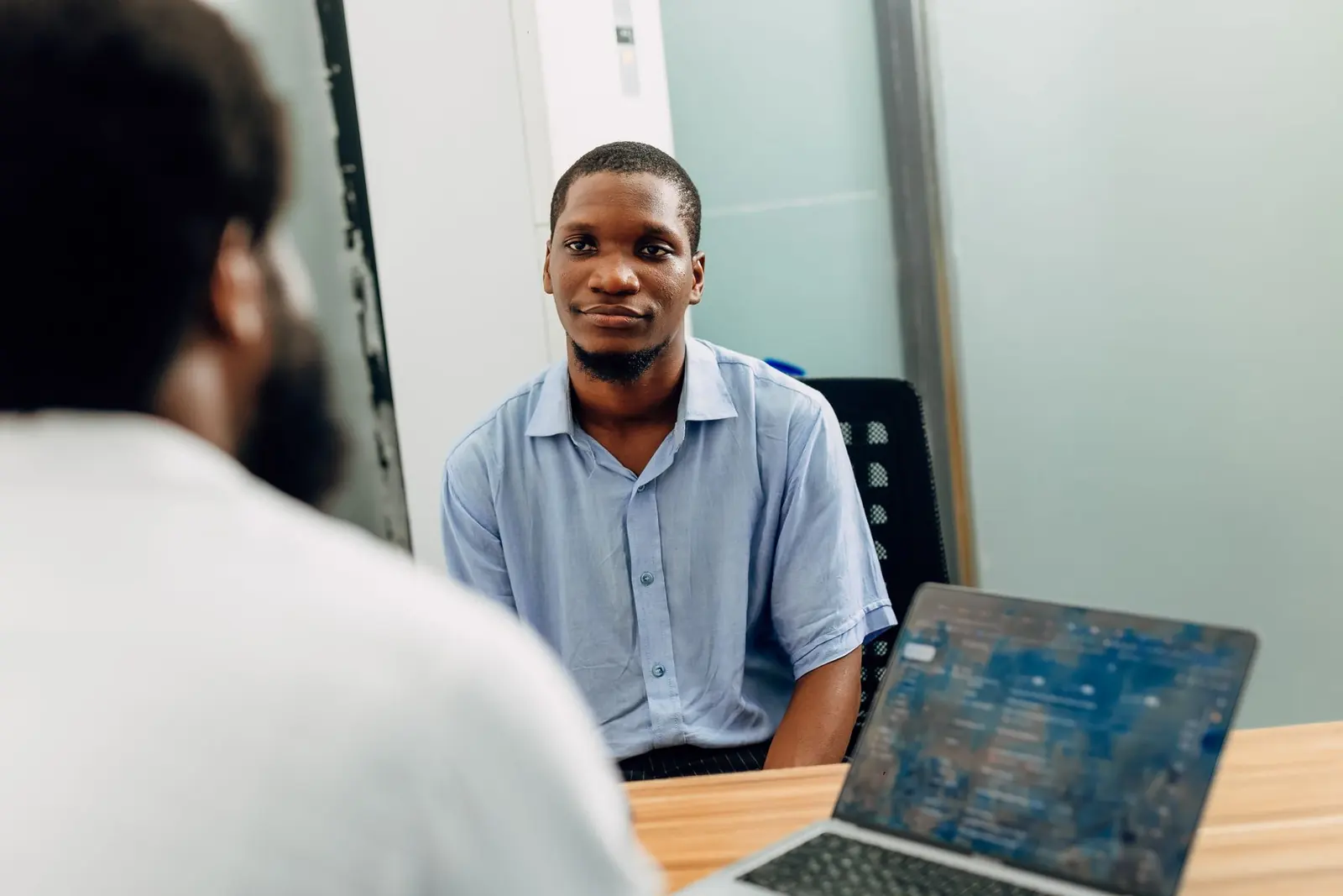 A professional interview taking place in a Lagos office